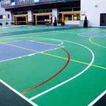 Professional sports flooring installation in a modern indoor gymnasium