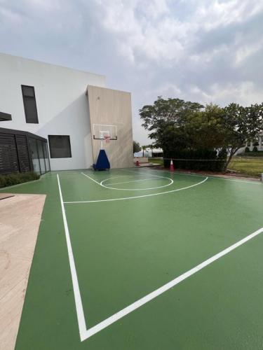 Outdoor basketball court with acrylic sports flooring in UAE